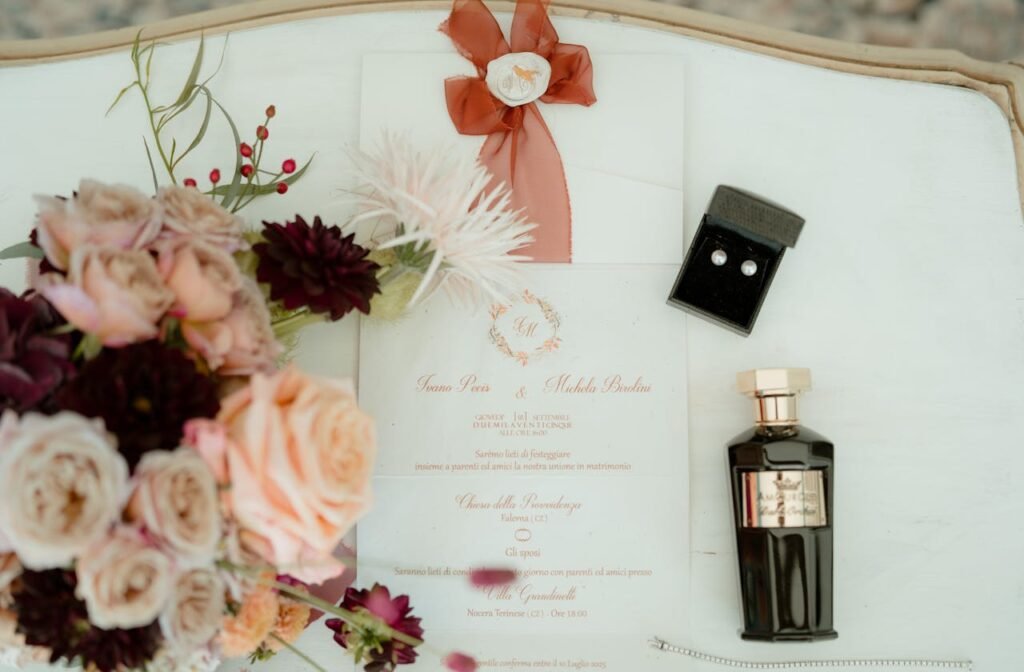 Crafting Captivating Headlines: Your awesome post title goes here A stylish flat lay featuring a wedding invitation, flowers, perfume, and jewelry with a classic touch.